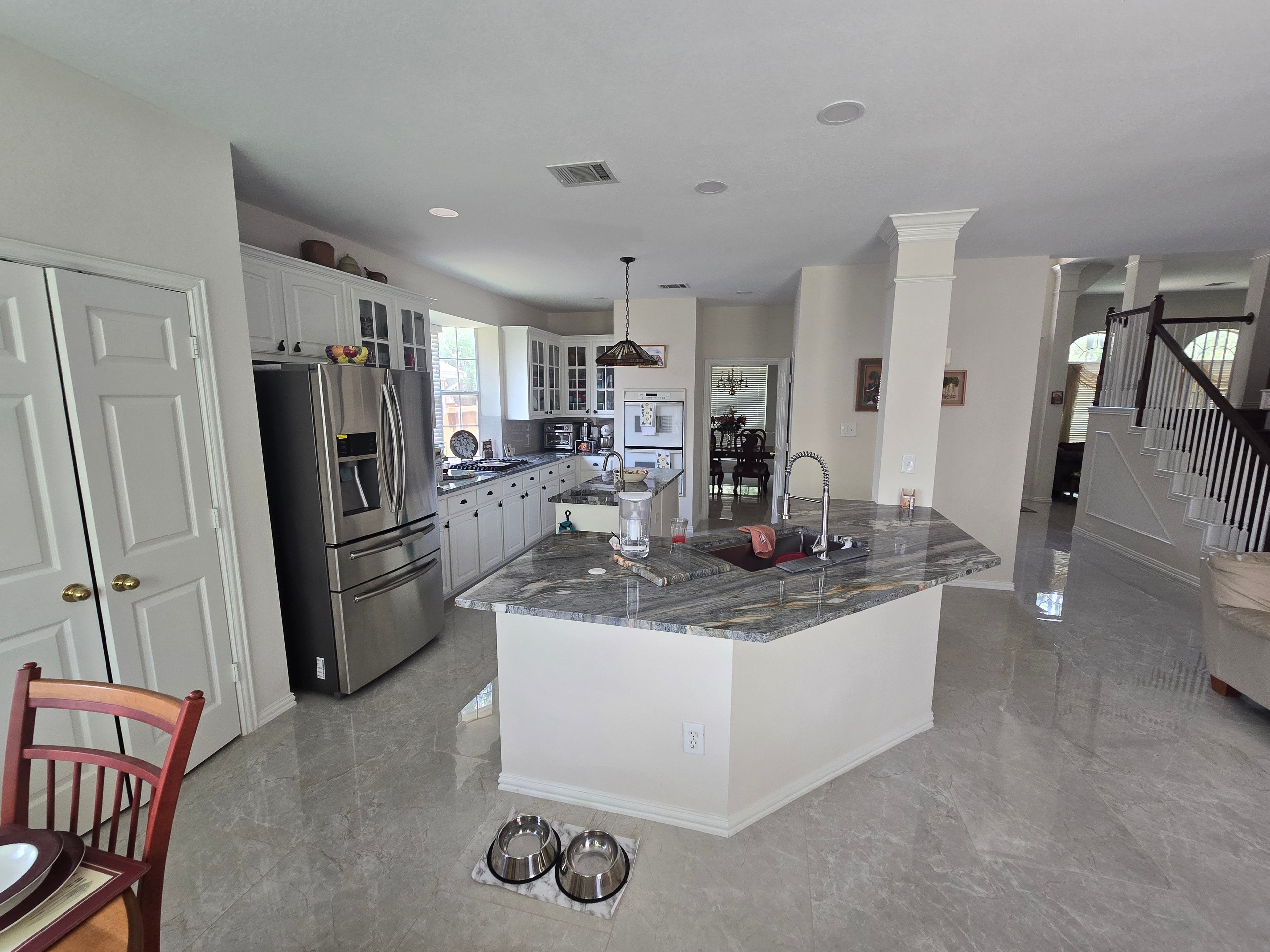 Completed kitchen refresh with refinished cabinets, quartzite countertops, tile backsplash, and new flooring — Fort Worth, TX